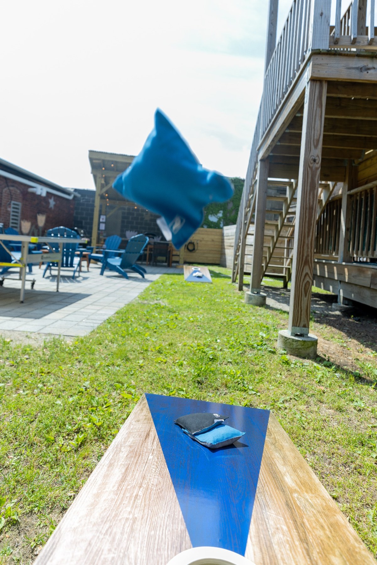 Cornhole board on the backyard lawn