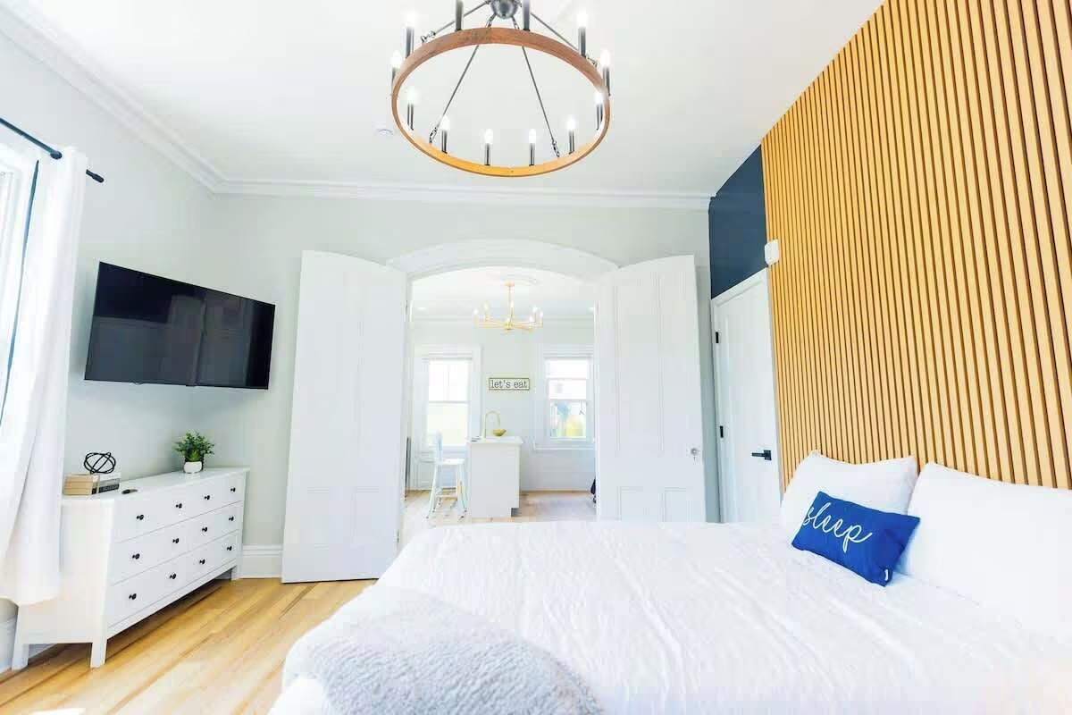 Broadway bedroom with wood accent wall